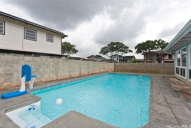 view of swimming pool with a fenced backyard and a fenced in pool