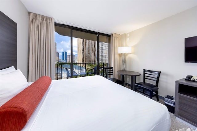 bedroom with floor to ceiling windows