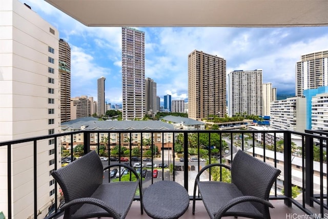 balcony featuring a city view