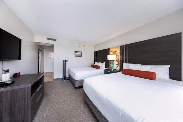 bedroom featuring visible vents and baseboards