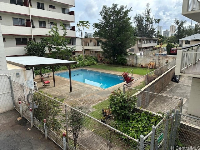 pool featuring a fenced backyard