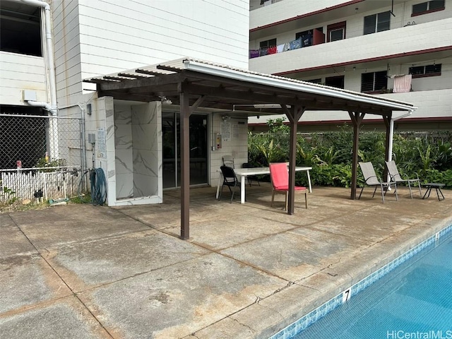 view of patio / terrace featuring fence and a pergola