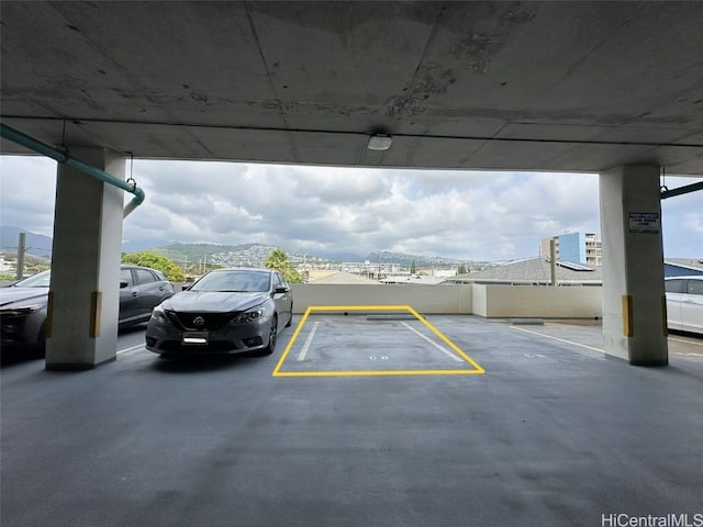 view of vehicle parking featuring a parking deck