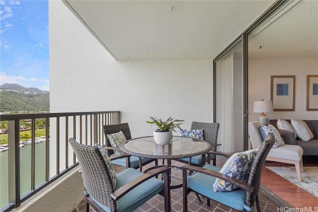 balcony featuring a mountain view