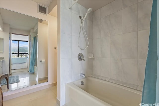 full bath with tile patterned flooring, shower / bath combination with curtain, and visible vents