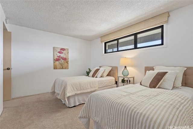 carpeted bedroom with a textured ceiling