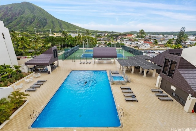 pool with a mountain view and a gazebo