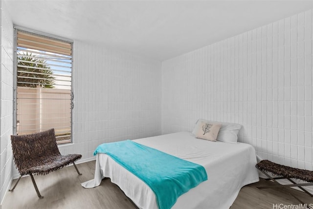 bedroom with wood finished floors