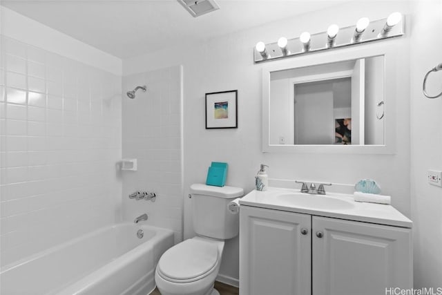 bathroom with visible vents,  shower combination, vanity, and toilet