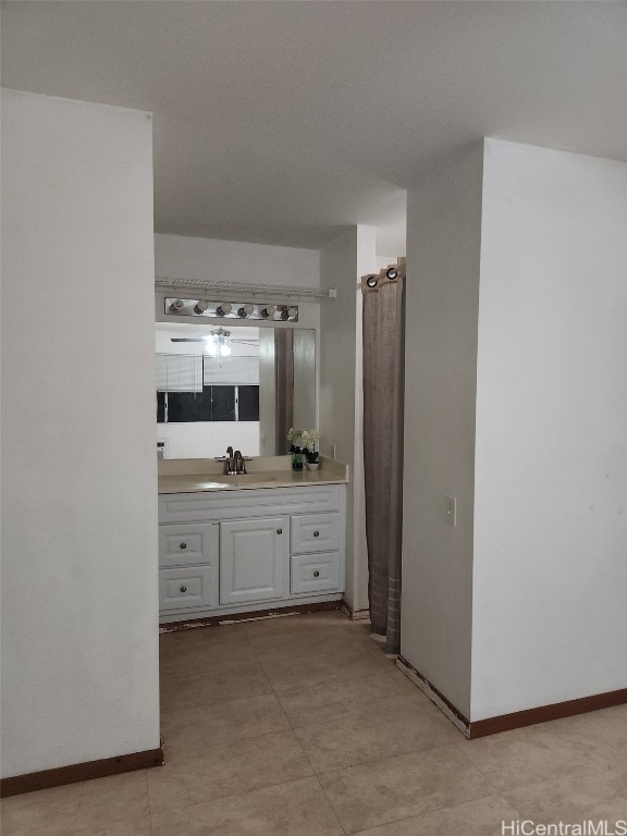 bathroom featuring vanity and baseboards