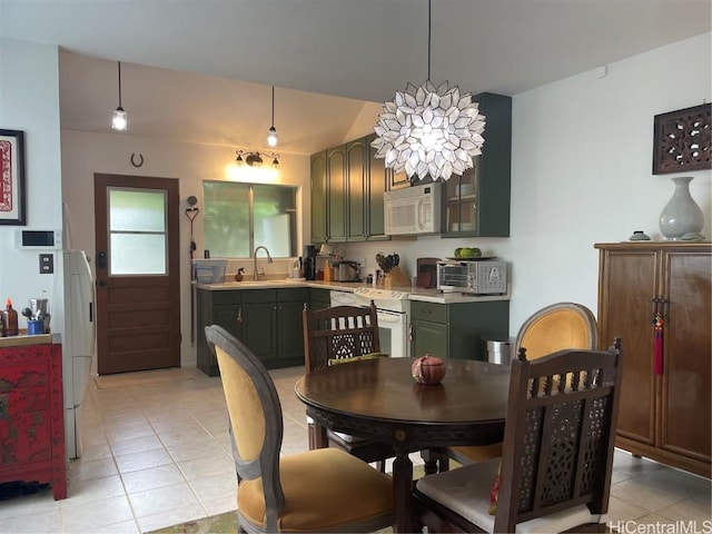 dining space with light tile patterned floors, vaulted ceiling, and a toaster