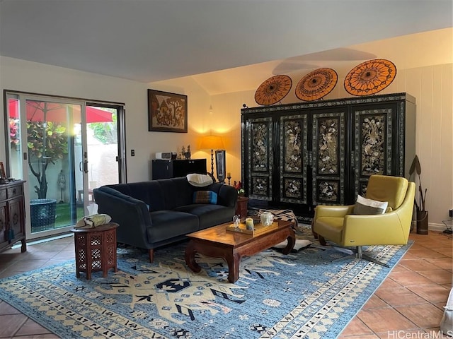 interior space with lofted ceiling and tile patterned floors