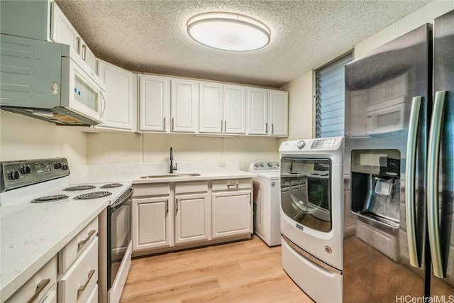 kitchen featuring electric range, stainless steel fridge with ice dispenser, light wood-style flooring, light countertops, and a sink