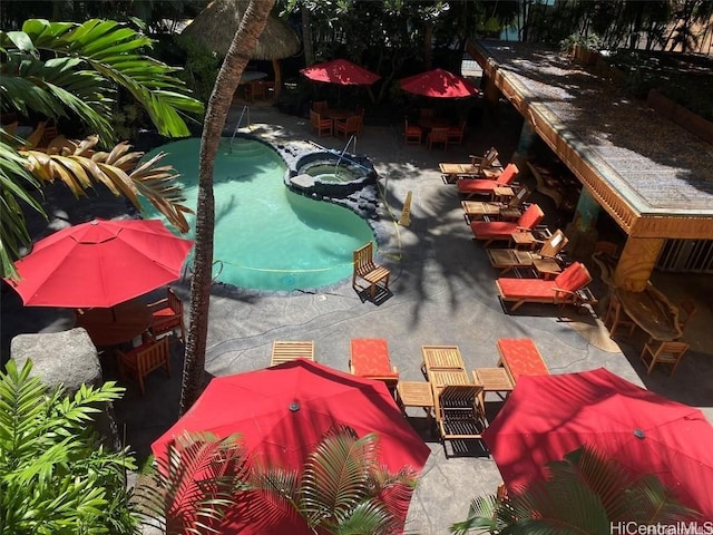 view of swimming pool featuring a patio