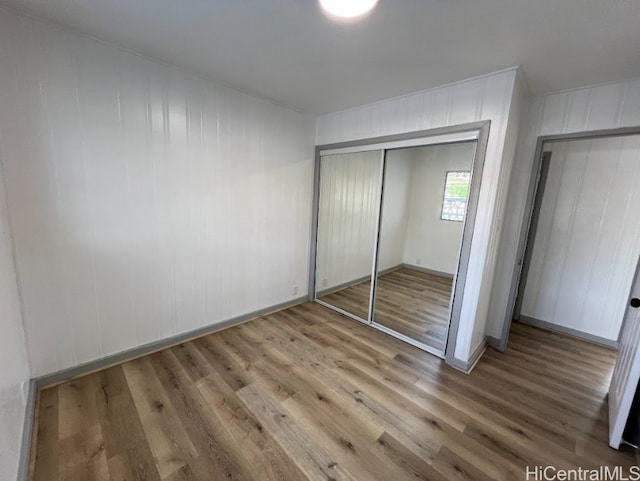 4509 Luaole St, Honolulu, HI 96818 - unfurnished bedroom featuring a closet and wood finished floors