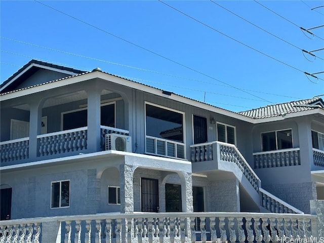 view of property exterior featuring a fenced front yard and a porch