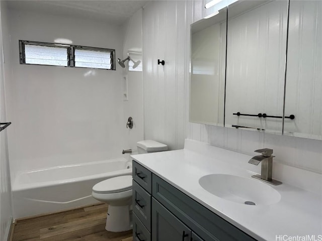 4509 Luaole St, Honolulu, HI 96818 - bathroom with toilet, washtub / shower combination, wood finished floors, and vanity