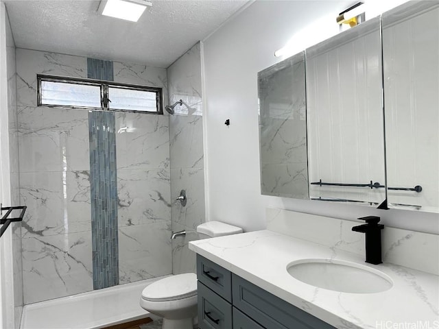 4509 Luaole St, Honolulu, HI 96818 - bathroom featuring toilet, vanity, a marble finish shower, and a textured ceiling