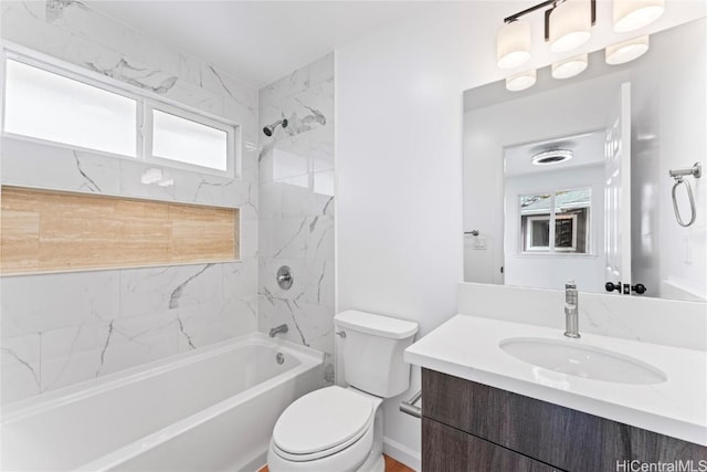 bathroom with toilet, washtub / shower combination, and vanity