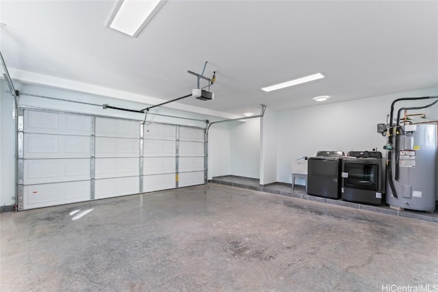 garage featuring a garage door opener, water heater, and separate washer and dryer