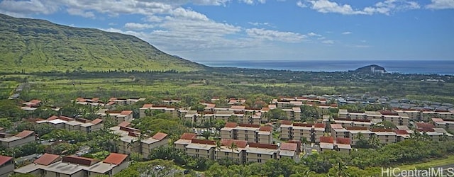 aerial view featuring a water and mountain view