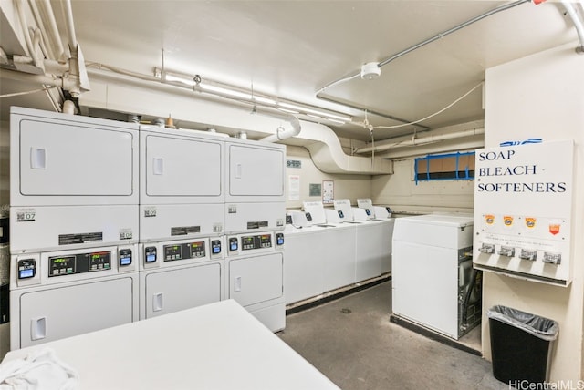 community laundry room featuring stacked washer / dryer and washer and clothes dryer