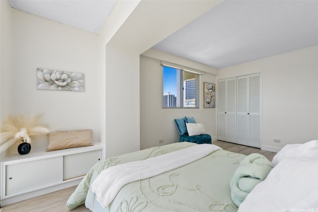 2440 Kuhio Ave Unit 1101, Honolulu, HI 96815 - bedroom featuring wood finished floors and a closet