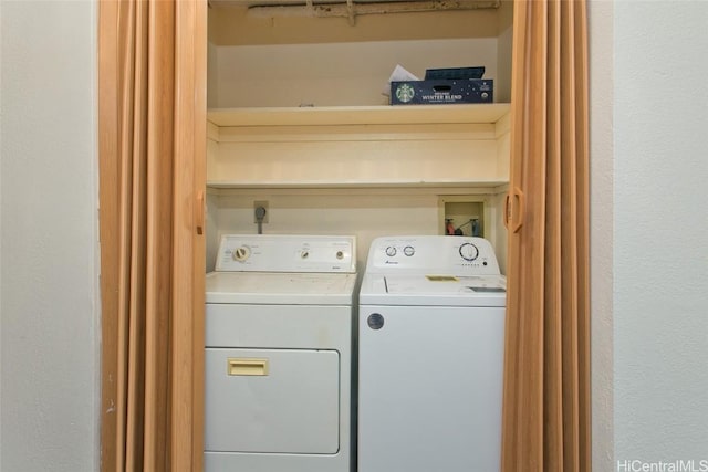 washroom featuring laundry area and washer and clothes dryer