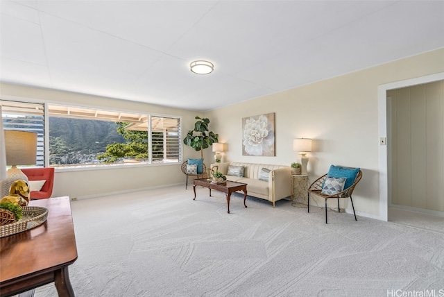 living room with baseboards and carpet floors