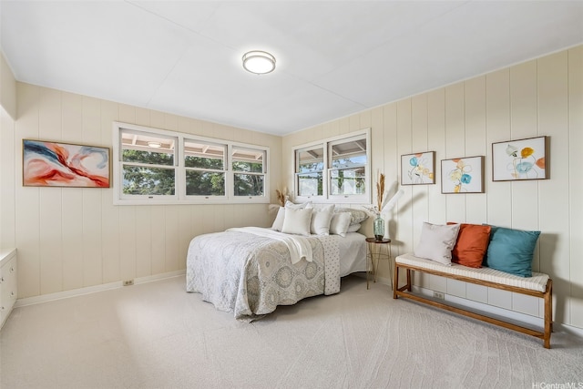 carpeted bedroom featuring baseboards