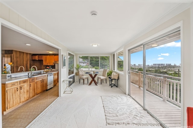 sunroom with a city view and carpet floors