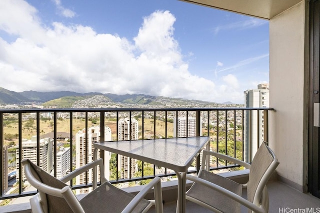 balcony featuring a mountain view