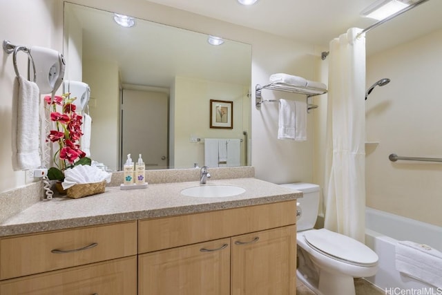 full bathroom with toilet, vanity, and shower / tub combo