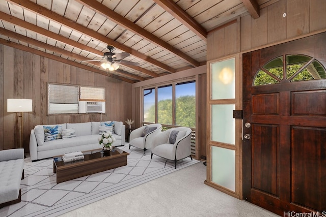 living area featuring light carpet, wood walls, vaulted ceiling with beams, and wood ceiling