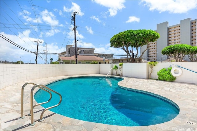 view of swimming pool with a patio area, a fenced backyard, and a fenced in pool