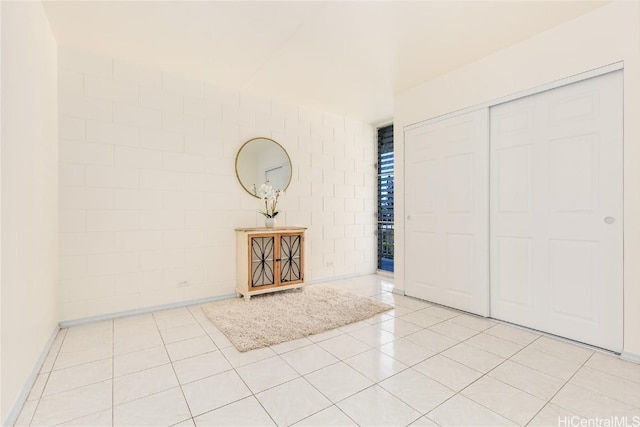 foyer featuring light tile patterned flooring