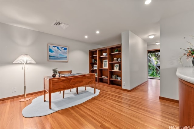 home office with light wood-style floors, baseboards, visible vents, and recessed lighting