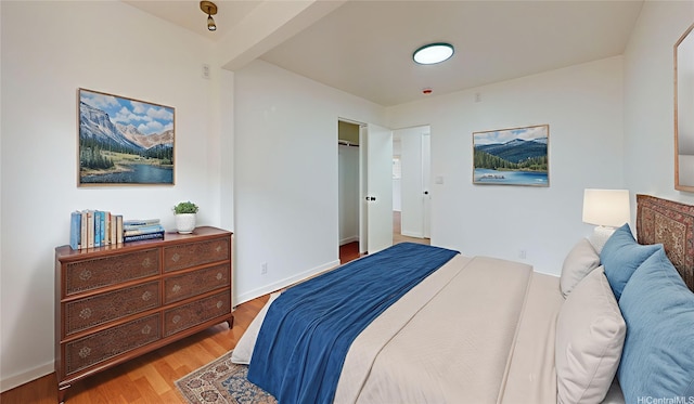 84-562 Nukea St, Waianae, HI 96792 - bedroom featuring wood finished floors and baseboards