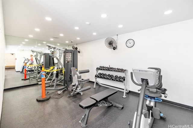 exercise room with recessed lighting and baseboards