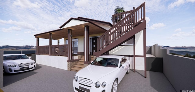 3503-A Wela St, Honolulu, HI 96815 - view of property exterior featuring stairway, stucco siding, and a mountain view