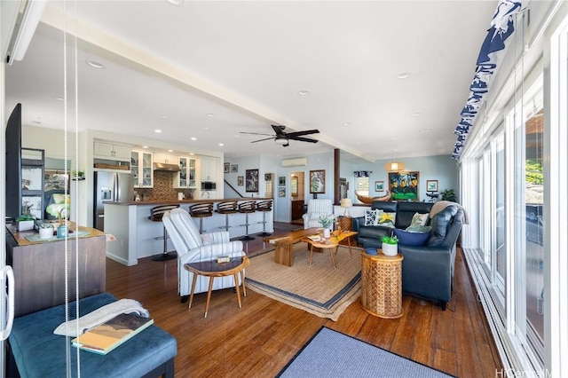 living area with recessed lighting, dark wood-style floors, and a ceiling fan