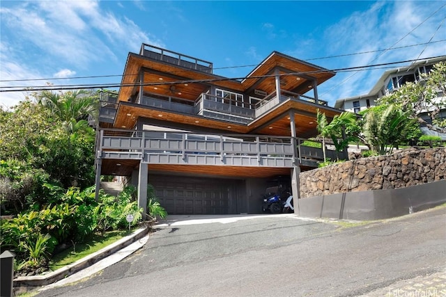 exterior space with a balcony and an attached garage