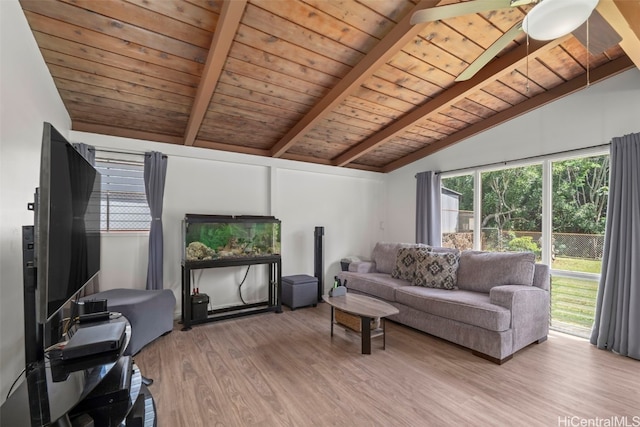 living room with vaulted ceiling with beams, wood ceiling, and wood finished floors