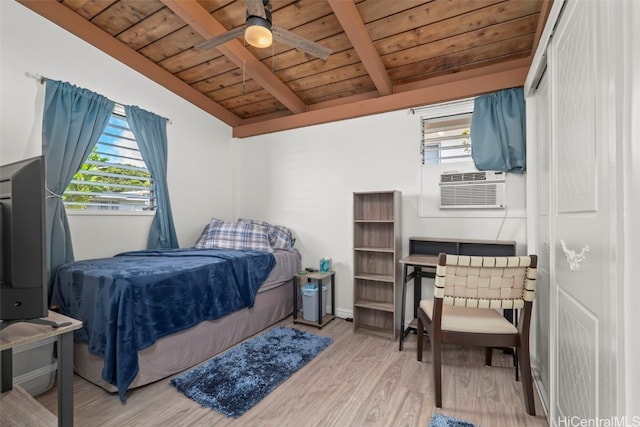 bedroom with wood ceiling, multiple windows, vaulted ceiling with beams, and wood finished floors