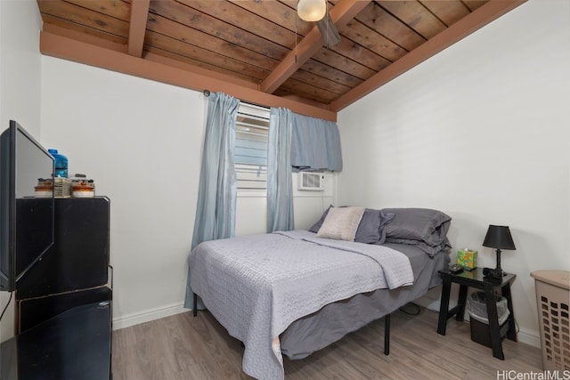 bedroom with baseboards, lofted ceiling with beams, wooden ceiling, cooling unit, and light wood-type flooring