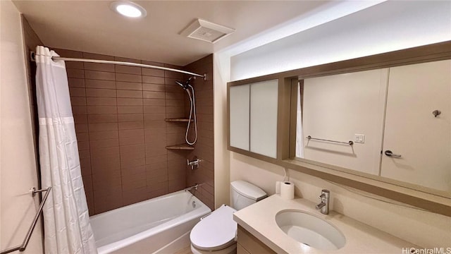 full bath featuring visible vents, vanity, toilet, and shower / bathtub combination with curtain