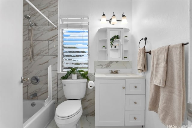 bathroom featuring toilet, shower / washtub combination, and vanity