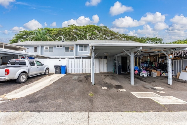 view of parking with fence