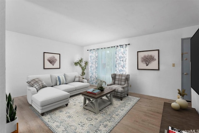 living area with light wood-style floors