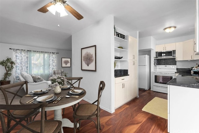 dining room with ceiling fan, baseboards, and dark wood finished floors